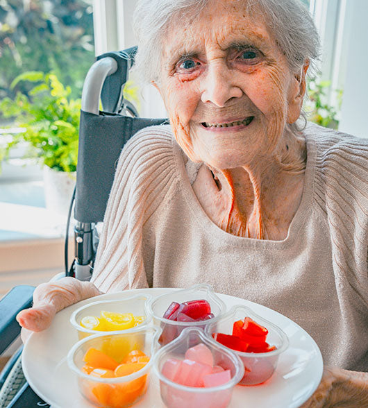 Woman With Dementia Holding Jelly Drops