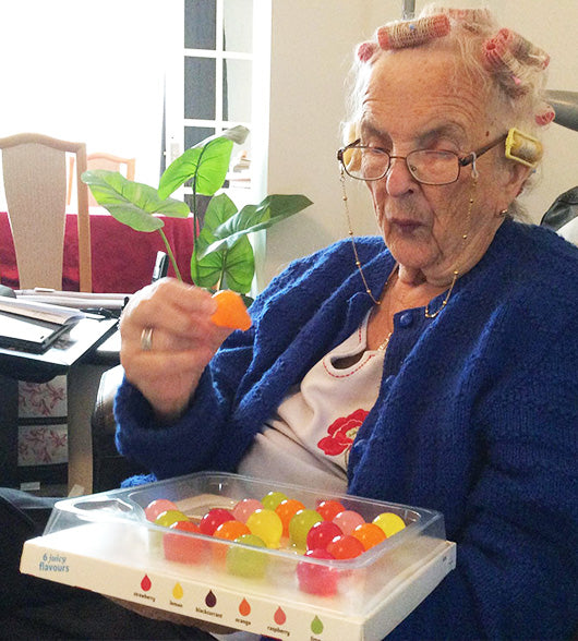 Woman With Dementia Eating Jelly Drops